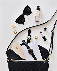 sunglasses, watch, lipstick, and fragrance bottle came out from leather bag thumbnail