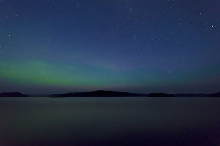 landscape photography of Aurora Borealis over mountains thumbnail
