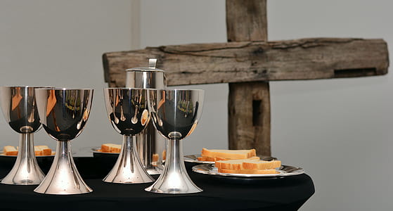 silver chalice on table thumbnail