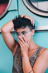 woman in gray tank top wearing eyeglasses thumbnail