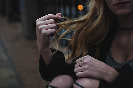 woman touching her hair thumbnail