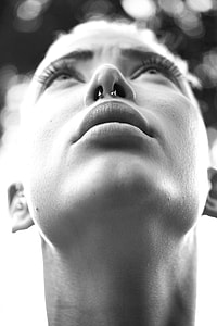woman with nose peircings in grayscale photo thumbnail