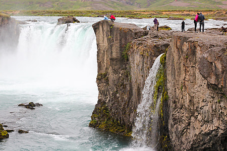 People by waterfall thumbnail