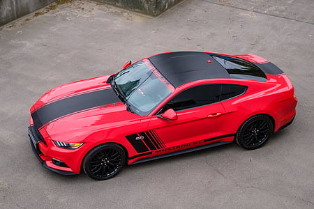 black and red coupe parked on road thumbnail