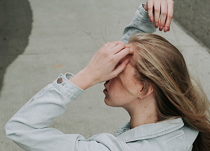 woman in gray denim jacket during daytime thumbnail