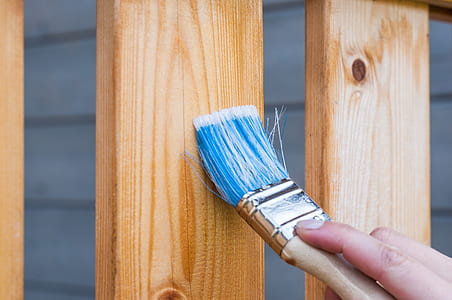 person holding paint brush thumbnail
