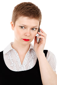 woman with white and black collared shirt using white QWERTY phone thumbnail