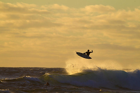 person surfing during daytime thumbnail