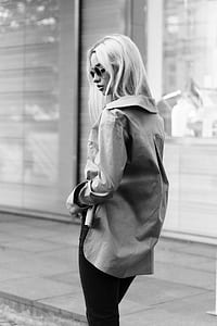 grayscale photo of woman near sidewalk thumbnail