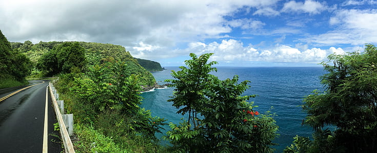landscape photo of black concrete bridge near open sea at daytime thumbnail