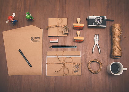gray and black SLR camera on top of table thumbnail