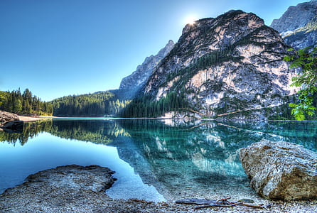 body of water by the mountain thumbnail