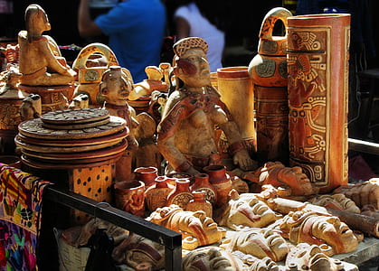 male figurines and head busts on table thumbnail