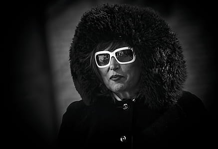 grayscale photo of woman wearing fur jacket thumbnail