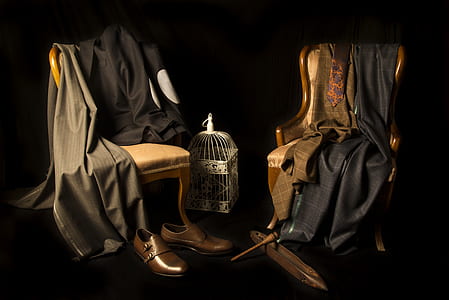 two brown padded chairs with brown wooden frames thumbnail