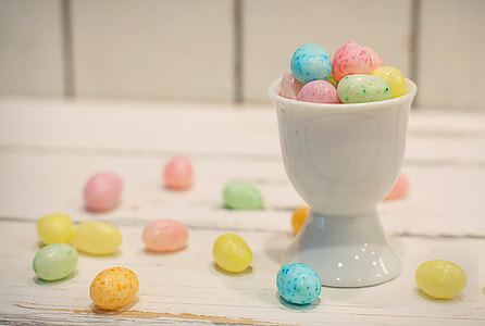 egg candies surrounded beside ceramic footed cup thumbnail