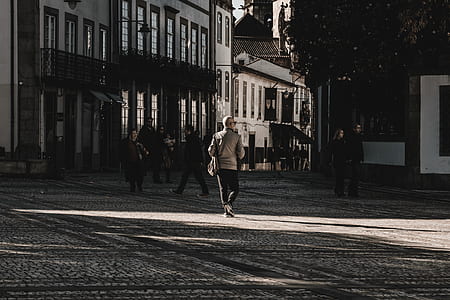 group of people walking on the street during daytime thumbnail