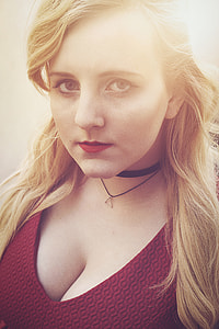 closeup photo of woman wearing red plunging-neckline top thumbnail