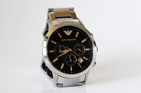 round silver-colored Emporio Armani chronograph watch placed on white surface thumbnail