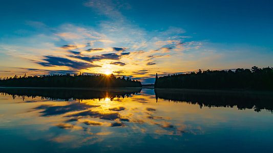 Sunset over the lake with sky and clouds thumbnail