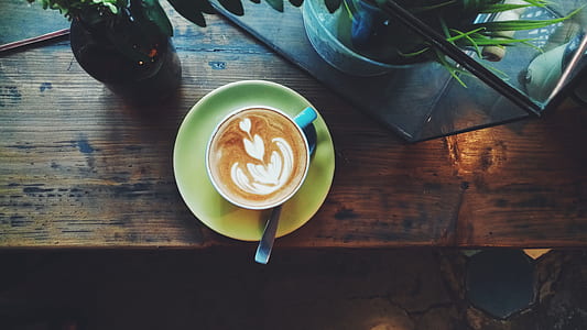 top view of latte in cup on table thumbnail