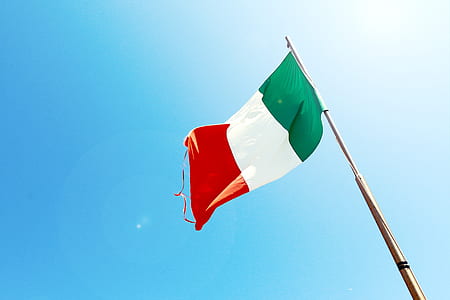 red, white, and green flag on pole thumbnail