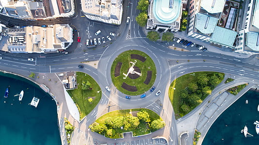 aerial photography of city and body of water thumbnail