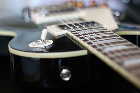 black acoustic guitar thumbnail
