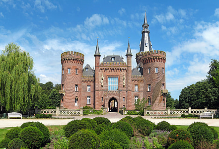 brown castle surrounded by green leaf trees thumbnail