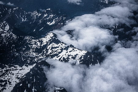 aerial view of body of water covered in fog during daytime thumbnail