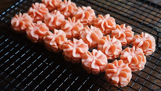 Close-up Photo of Pink Icing on Black Screen thumbnail