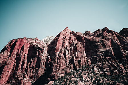 Grand canyon sandstone peaks under clear sky and bright sunlight thumbnail
