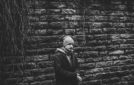 Person Standing Wearing Black Coat thumbnail