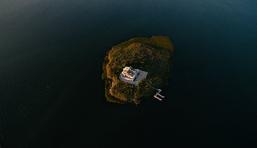 bird's eye view photography of white house on island thumbnail