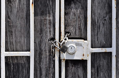gray metal framed brown wooden gate with padlock thumbnail