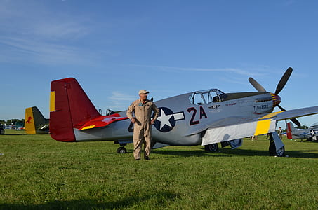 man standing beside plane thumbnail