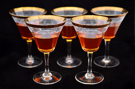 five clear glass martini glass filled with liquids thumbnail