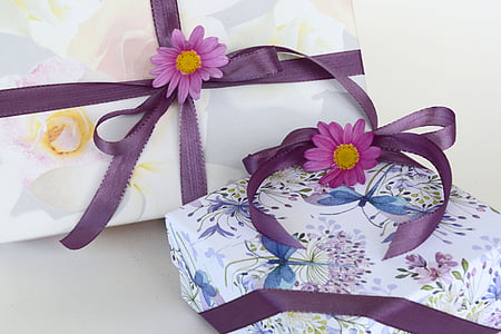 two white floral gift boxes with purple ribbons thumbnail