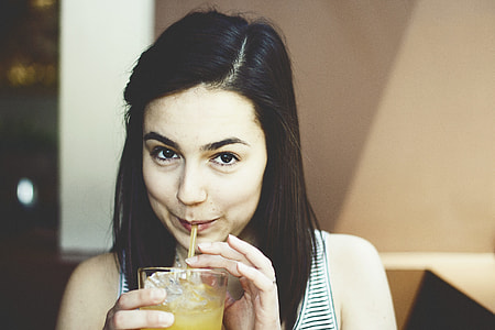 woman drinking pineapple juice thumbnail