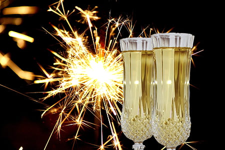 two glasses of yellow liquid and sparklers thumbnail