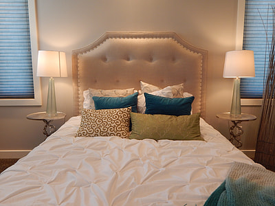 white bed sheet and tufted headboard thumbnail