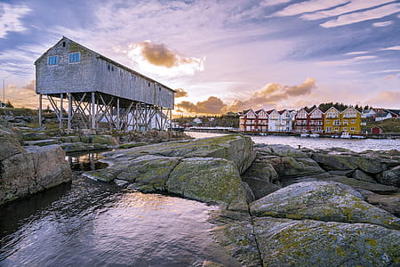 white factory near rock thumbnail