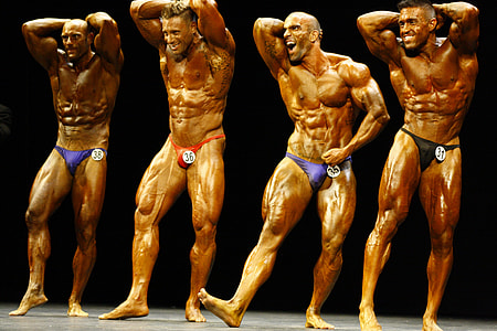 four men bodybuilders on stage thumbnail