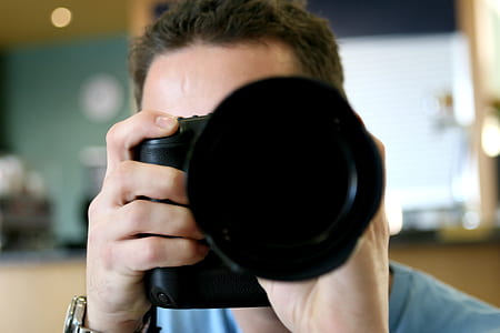 person taking a photo using camera thumbnail