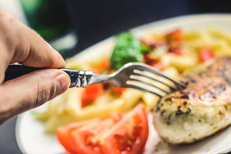 selective focus of gray fork on cooked food thumbnail