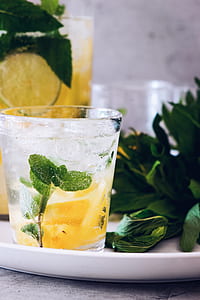 clear drinking glass filled with beverage thumbnail