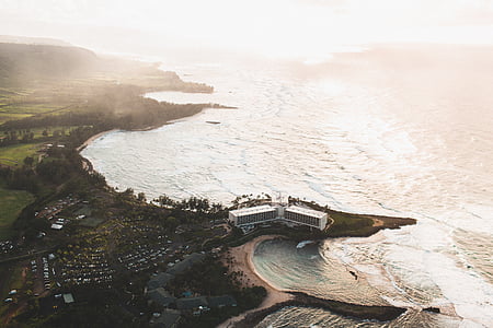 aerial photo of building near body of water thumbnail