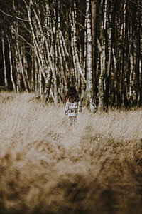 girl near bare trees thumbnail