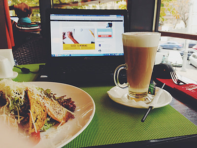 filled glass cup near turned-on Asus laptop thumbnail