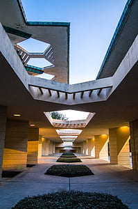 gray concrete building under white and gray sky thumbnail